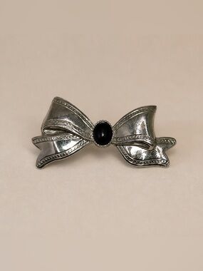 Silver Tone Bow Brooch with Black Center